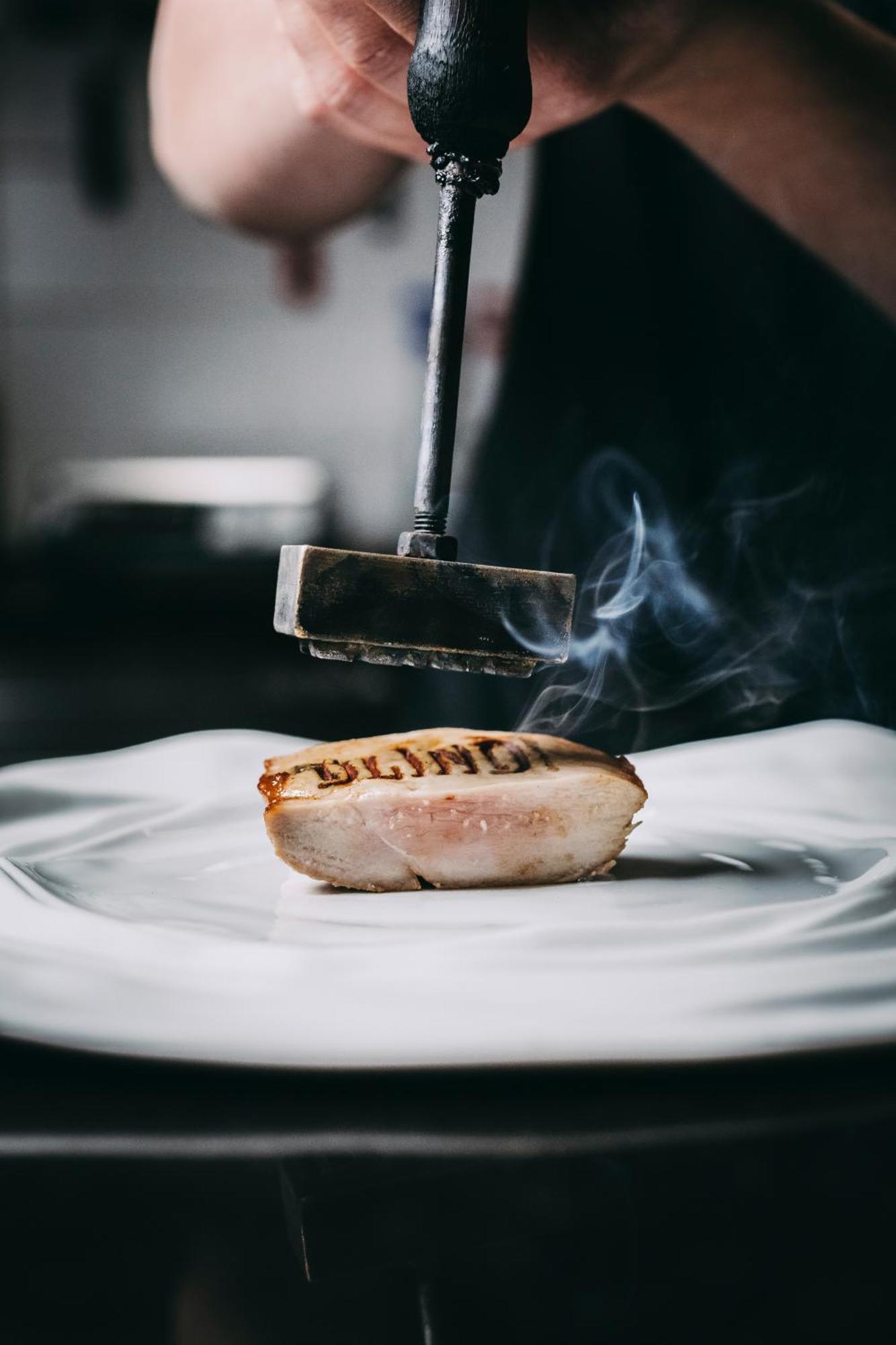 Torel Palace Порто Екстериор снимка A meat mallet being used to tenderize a steak